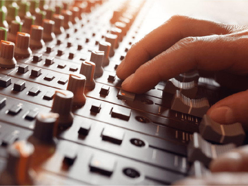 Fingers on mix desk